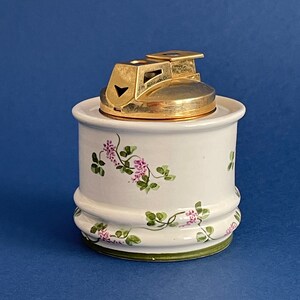 A feminine tabletop cigarette lighter. German Rosenthal Corona white porcelain.