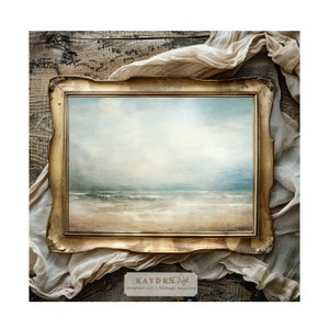 May include: A framed painting of a seascape with a sandy beach, blue water, and a cloudy sky. The frame is gold and has a decorative design. The painting is on a wooden surface with a piece of fabric draped over it.