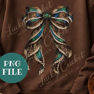 May include: A digital design featuring a large bow made of feathers in shades of brown, teal, and blue. The bow is centered on a brown background. The words "PNG FILE" are in a teal circle. The words "Lucky Cricket Design Co." are written in script.