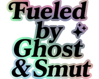 May include: A holographic sticker with the text "Fueled by Ghost & Smut" in a black, bold font. The text is outlined with a rainbow gradient. Two small, sparkling star graphics are to the right of the text.