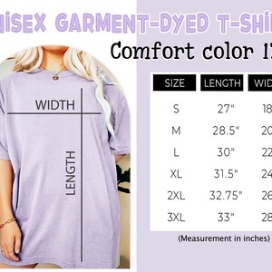 May include: A lavender unisex garment-dyed t-shirt with a size chart showing measurements in inches. The chart shows sizes S through 3XL with corresponding length and width measurements.