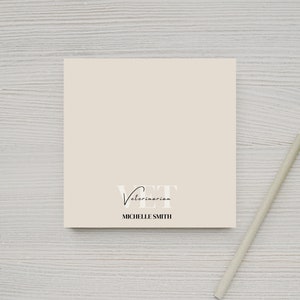 May include: A beige card with the text "VET Veterinarian" and "MICHELLE SMITH" in black lettering.