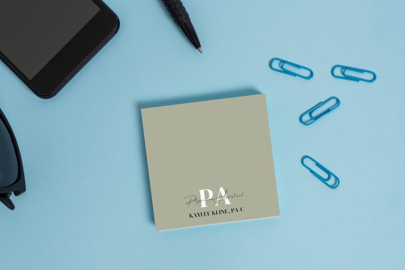 May include: A light gray square sticky note with the text "Physician Assistant" and "KAMLEE KLINE, PA-C" in black text.