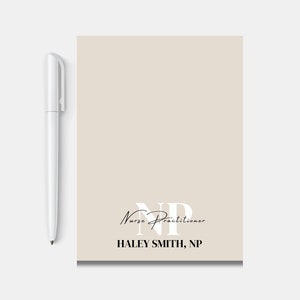 May include: A beige notepad with the text "Nurse Practitioner" and the initials "NP" in white. The name "HALEY SMITH, NP" is printed in black at the bottom.