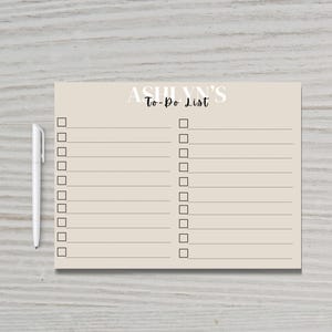 May include: A beige to-do list with the text "ASHLYNN'S To-Do List" at the top. The list has two columns with 15 blank checkboxes in each column.
