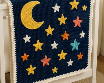 May include: A navy blue crochet baby blanket with a yellow crescent moon and various colored stars. The blanket is trimmed with a white, scalloped edge and is draped over a white crib.