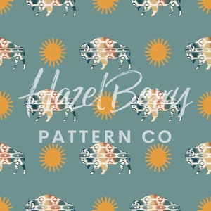 May include: A seamless pattern featuring a stylized buffalo with a geometric design in shades of blue, brown, and white, and a yellow sun on a teal background. The text "Hazel Berry Pattern Co." is written in white cursive.