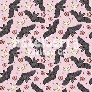 May include: A repeating pattern of cartoon bats, crescent moons, flowers, and stars on a pale pink backdrop. The bats are grey, the moons are yellow, the flowers are pink, and the stars are black.