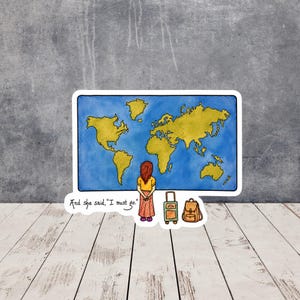May include: A sticker featuring a watercolor-style world map with yellow continents on a blue ocean. A person with reddish-brown hair stands before the map with a suitcase and backpack. The text reads, "And she said, "I must go."" in black ink.
