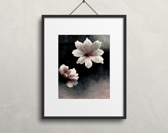 May include: A framed print of two white flowers with pink centres on a dark background.