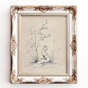 May include: A framed pencil sketch of a fox in a field, surrounded by tall grass and flowering plants. The artwork is in a white and gold ornate frame, creating a vintage aesthetic. The fox is the focal point.