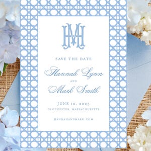 May include: A light blue and white wedding invitation with a lattice border. The invitation reads "Save the Date" and includes the names Hannah Lynn and Mark Smith, along with the date June 10, 2025.