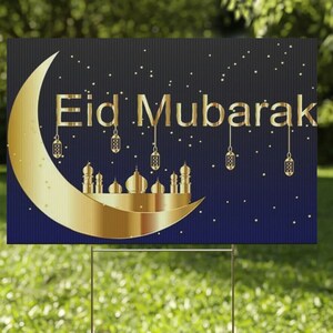 May include: A blue and gold yard sign with a crescent moon and a mosque silhouette. The sign reads "Eid Mubarak".