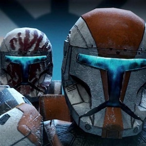 May include: Four tactical helmets with glowing blue T-shaped visors. The helmets feature weathered white, gray, and orange panels, with one helmet displaying a distinct red handprint pattern and another featuring a green stripe on the crown.