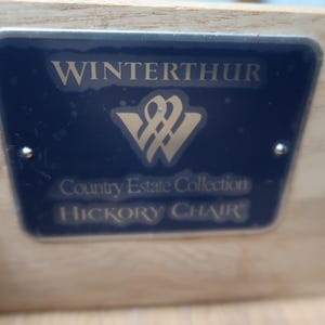 May include: A blue and silver label with the text "Winterthur Country Estate Collection Hickory Chair".