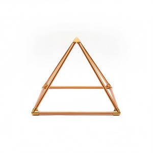 May include: A geometric pyramid structure constructed from polished copper tubing. The frame features four base bars and four angled side bars meeting at a single apex point, all connected by gold-toned metal corner joints and a top cap piece.