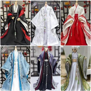 May include: A collection of six doll-sized traditional Asian-style outfits. The garments feature a variety of colors, including black, white, red, blue, purple, and green. Each outfit has intricate details, such as layered fabrics, decorative trim, and flowing sleeves.