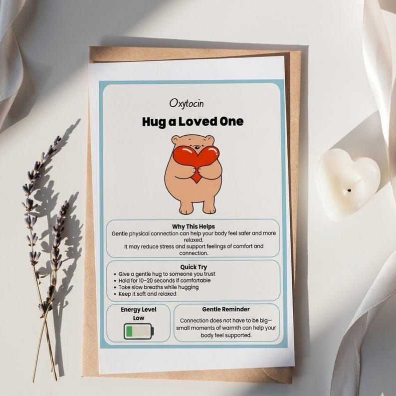 May include: A greeting card with the text "Oxytocin Hug a Loved One" and an illustration of a bear holding a heart. The card includes information about the benefits of hugging and how to do it. The card is on a brown envelope.