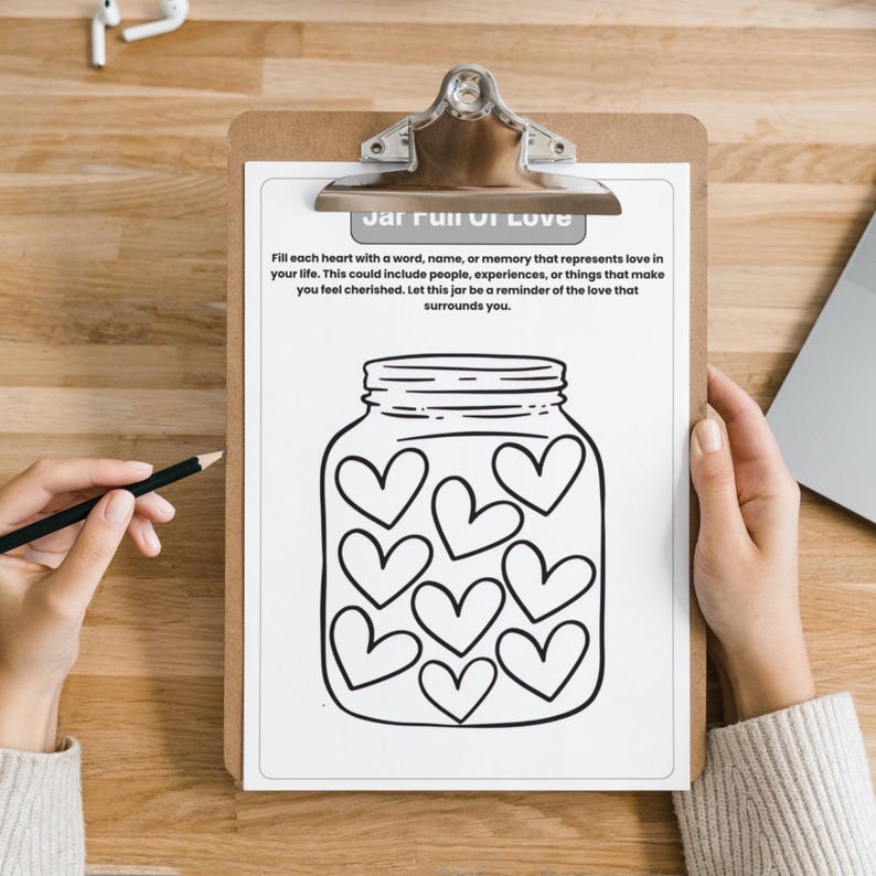May include: A printable worksheet with a jar full of hearts. The text on the worksheet says "Jar Full of Love" and instructs the user to fill each heart with a word, name, or memory that represents love in their life.