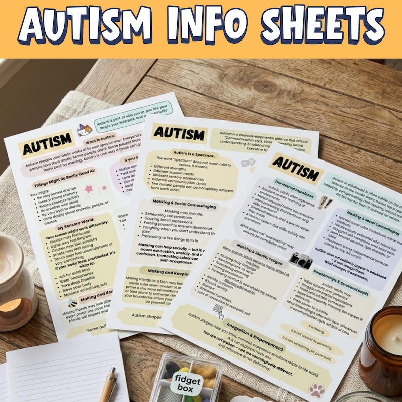 May include: A collection of printed autism info sheets with the title "AUTISM INFO SHEETS" in large blue letters. The sheets contain text and graphics about autism, including topics like sensory experiences and social camouflaging. A small "fidget box" is visible.
