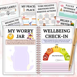 May include: A spiral-bound journal with various mental health worksheets, including "My Worry Jar" and "Wellbeing Check-In." A gold pen rests on the right side. The pages feature colorful illustrations and text related to emotional well-being.