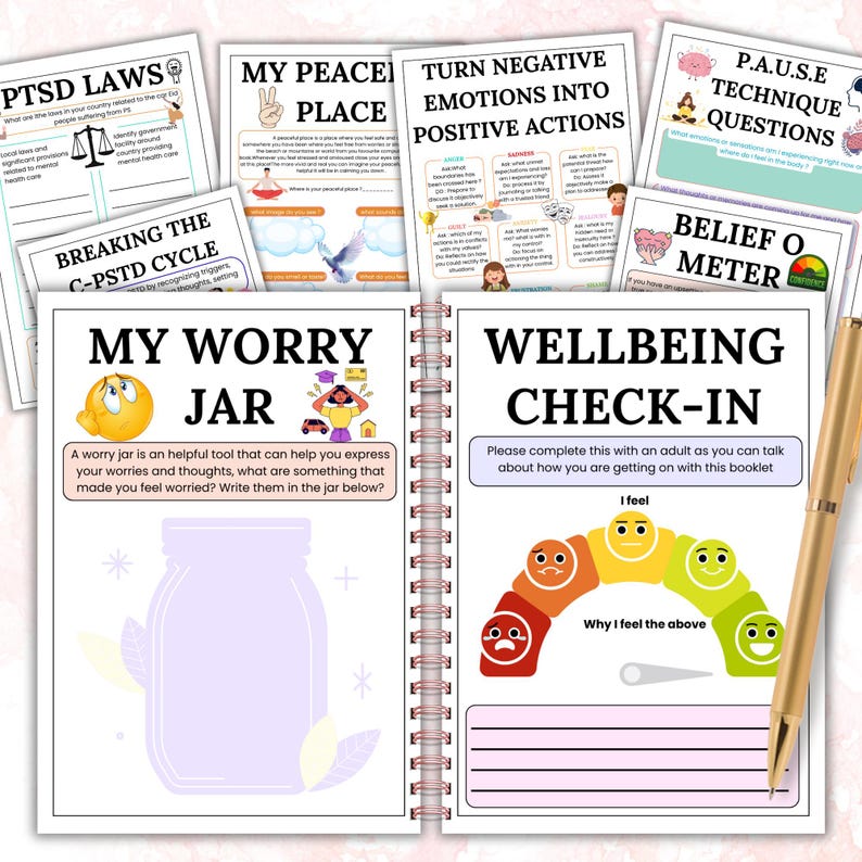 May include: A spiral-bound journal with various mental health worksheets, including "My Worry Jar" and "Wellbeing Check-In." A gold pen rests on the right side. The pages feature colorful illustrations and text related to emotional well-being.