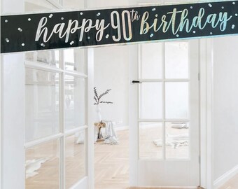 May include: A black and silver banner with the text "happy 90th birthday" in a sparkly font.