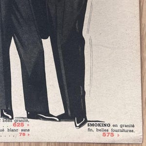 May include: A black and white illustration of two men in suits. The text in the image reads "N beau granit&eacute;, 625" and "SMOKING en granit&eacute; fin, belles fournitures. 575".