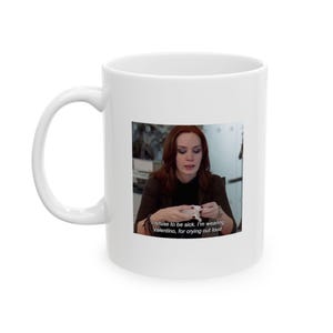 Puede incluir: Taza de cerámica blanca con una imagen impresa de una mujer sosteniendo un pañuelo. La imagen incluye el texto: "I refuse to be sick. I'm wearing Valentino, for crying out loud."