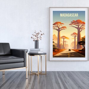 May include: A vintage travel poster with a sunset scene of a road lined with tall trees in Madagascar. The poster has the text "MADAGASCAR" in yellow and "TRAVEL GUIDE" in white.