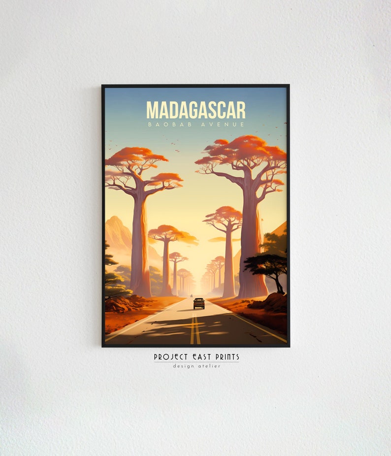 May include: A retro-style travel poster featuring a road lined with tall, orange baobab trees in Madagascar. The poster reads "Madagascar, Baobab Avenue, Project East Prints, design atelier".
