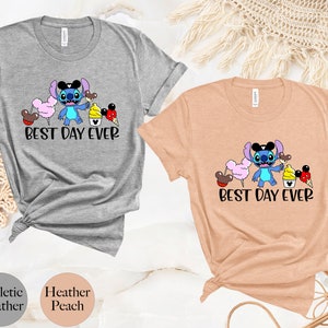 May include: Two t-shirts with a cartoon Stitch character holding a Mickey Mouse ice cream cone. The text "Best Day Ever" is printed on both shirts. The shirts are available in athletic heather and heather peach.