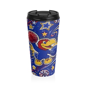May include: A blue travel mug with a black lid featuring a cartoon bird mascot with a red head and yellow beak holding red and blue pom-poms. The background is decorated with yellow and white stars and abstract red and blue graphic bursts.