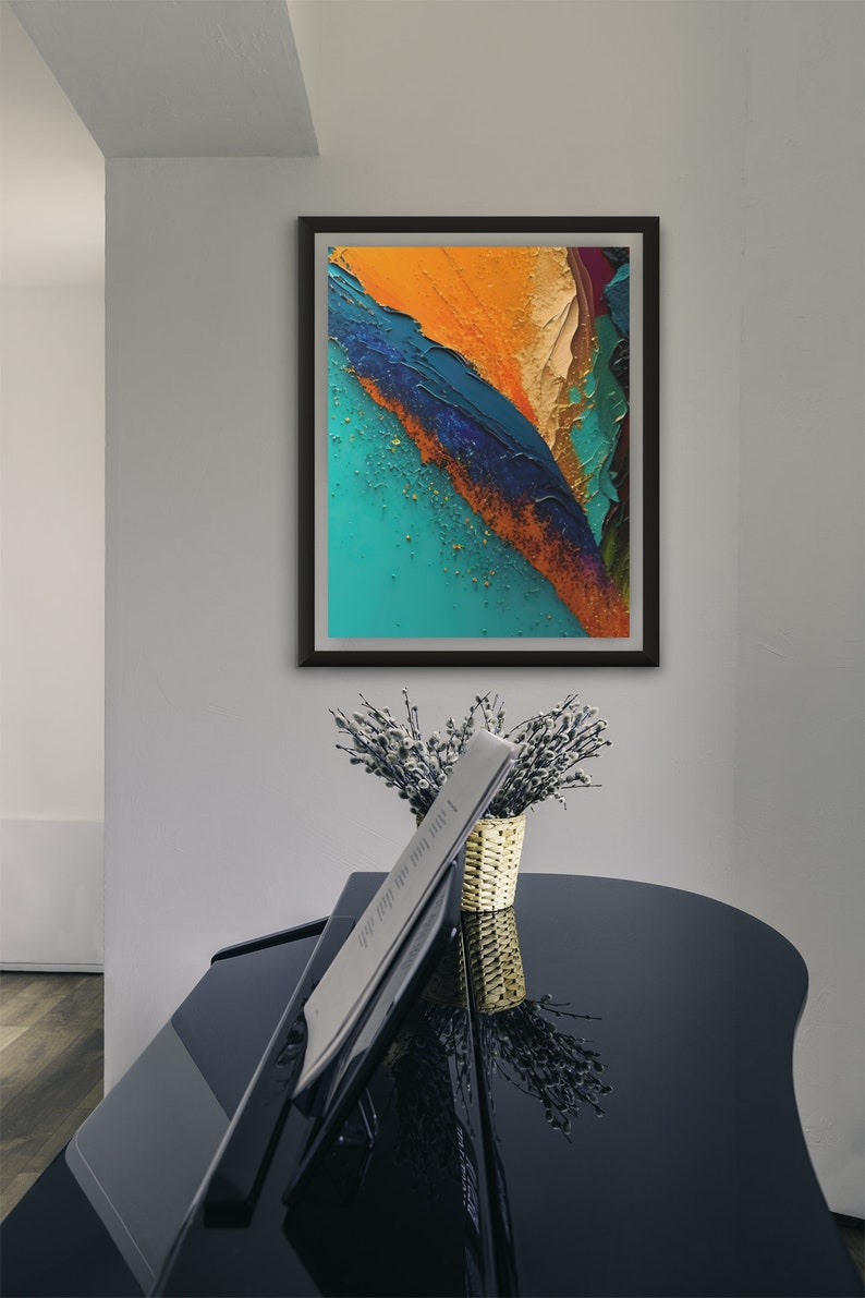 May include: Abstract painting in a black frame with a teal, orange, and blue color scheme. The painting is hanging on a white wall above a black piano.