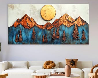 May include: A large, rectangular wall art piece depicting a mountain landscape. The artwork features copper-colored mountains, a golden sun, and blue and copper-colored trees. The piece is mounted above a white sofa in a living room setting.