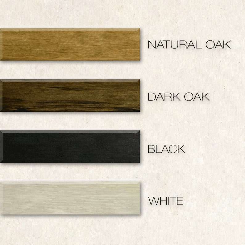 May include: A display of four rectangular wood samples in natural oak, dark oak, black, and white. The text on the right indicates the color of each sample. The samples are arranged vertically against a neutral background.