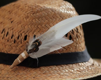 Feather decoration: hat feathers, feather brooch