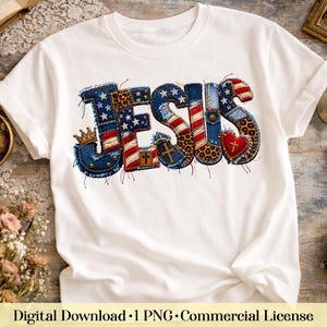 May include: A white short-sleeved t-shirt featuring the word JESUS in a patchwork design. The letters are composed of denim, American flag patterns, leopard print, and red fabric, accented with a gold crown, crosses, and a red heart.