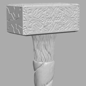 May include: A white, wooden hammer with a detailed, carved design. The hammer head has a textured surface and the handle is wrapped in a rope-like pattern. The bottom of the handle has a square base with a carved design.