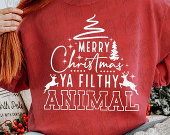 May include: A maroon sweatshirt with the text "Merry Christmas Ya Filthy Animal" in white. The design includes a Christmas tree, stars, and reindeer. The sweatshirt is part of a digital download collection.