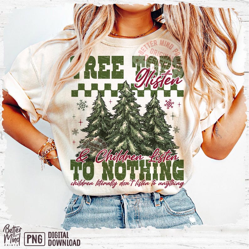 May include: Cream-colored t-shirt with a Christmas tree design. The shirt features the text "TREE TOPS Listen & Children Listen TO NOTHING" in green and burgundy. The phrase "children literally don't listen to anything" is also included.