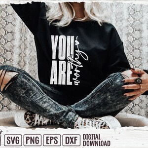May include: Black sweatshirt with the text "YOU ARE worthy" in white. The person is wearing distressed denim jeans and leopard print sneakers. The image includes the Better Mind Prints logo and digital download file types.