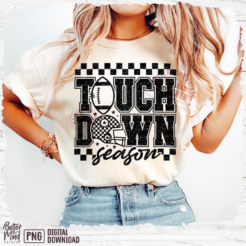 May include: A white t-shirt with a black graphic that says "Touch Down Season" with a football and a football helmet. The graphic has a checkered pattern.