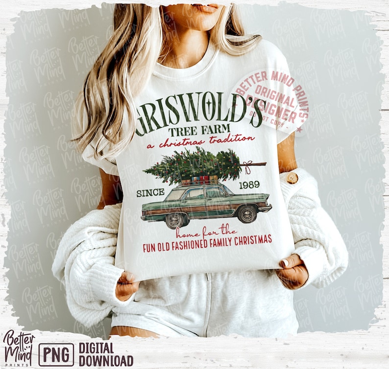May include: White t-shirt featuring a graphic of a green car with a Christmas tree on top, the text "GRISWOLD'S TREE FARM" and "home for the FUN OLD FASHIONED FAMILY CHRISTMAS". The design includes the year 1989.