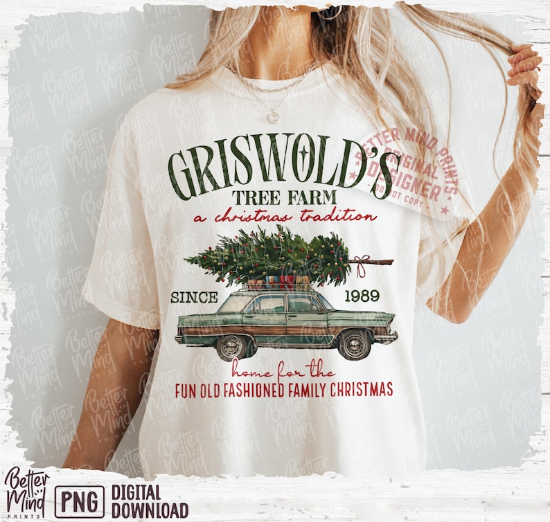 May include: Cream-colored t-shirt featuring a vintage green car carrying a Christmas tree. The shirt has the text "Griswold's Tree Farm" and "Since 1989" in green, with "a Christmas tradition" and "home for the fun old fashioned family Christmas" in red.