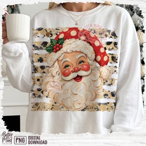 May include: A white crewneck sweatshirt featuring a graphic of Santa Claus with a red hat, white beard, and holly berries. The design is layered over horizontal stripes with a black and tan leopard print pattern. The text Better Mind Prints is visible.