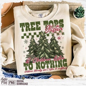 May include: Cream-colored sweatshirt with the text "TREE TOPS Listen & Children Listen TO NOTHING" and three green Christmas trees. The phrase "children literally don't listen to anything" is also printed on the sweatshirt.