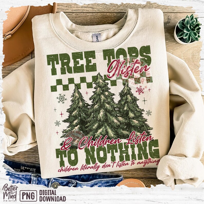 May include: Cream-colored sweatshirt with the text "TREE TOPS Listen & Children Listen TO NOTHING" and three green Christmas trees. The phrase "children literally don't listen to anything" is also printed on the sweatshirt.