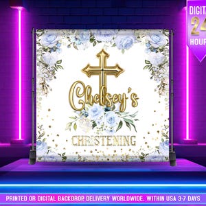 May include: A christening backdrop with a gold cross and the name "Chelsey's" in gold script. It features light blue roses and greenery on a white background. The word "CHRISTENING" is displayed below the name.