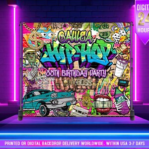 May include: A colorful backdrop with a graffiti-style design, featuring the words "GAULGA HIPHOP" and "38th BIRTHDAY PARTY." The backdrop includes illustrations of a classic car, dollar sign pendant, dice, and other hip-hop themed graphics. The text "DIGITAL 24 HOURS" is also visible.